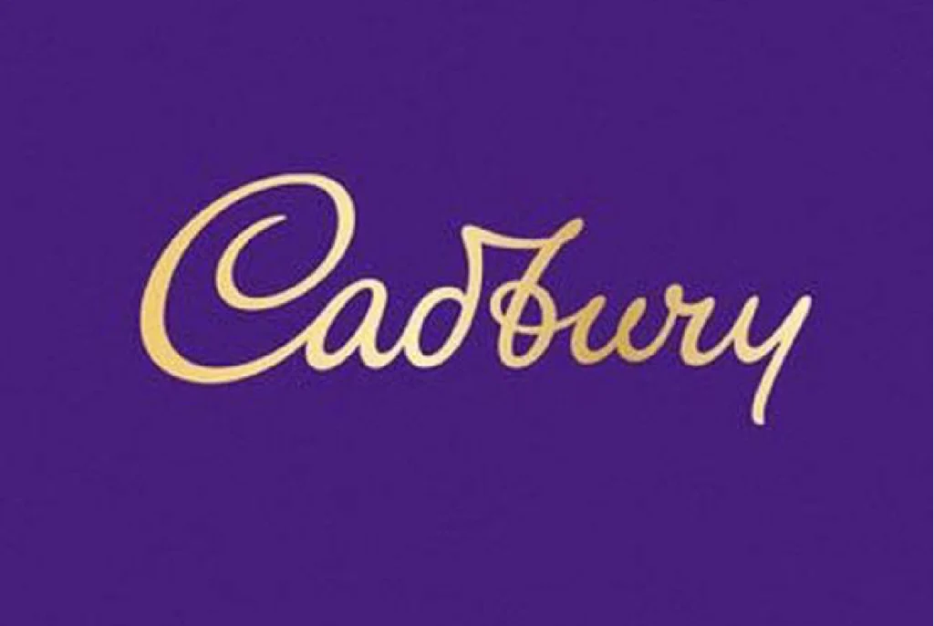 Cadbury logo in gold lettering on a purple background.