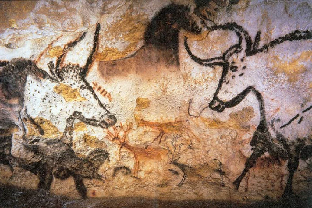 Prehistoric Lascaux cave painting showing animals drawn with black pigment, illustrating early human use of black for contrast and visual meaning.