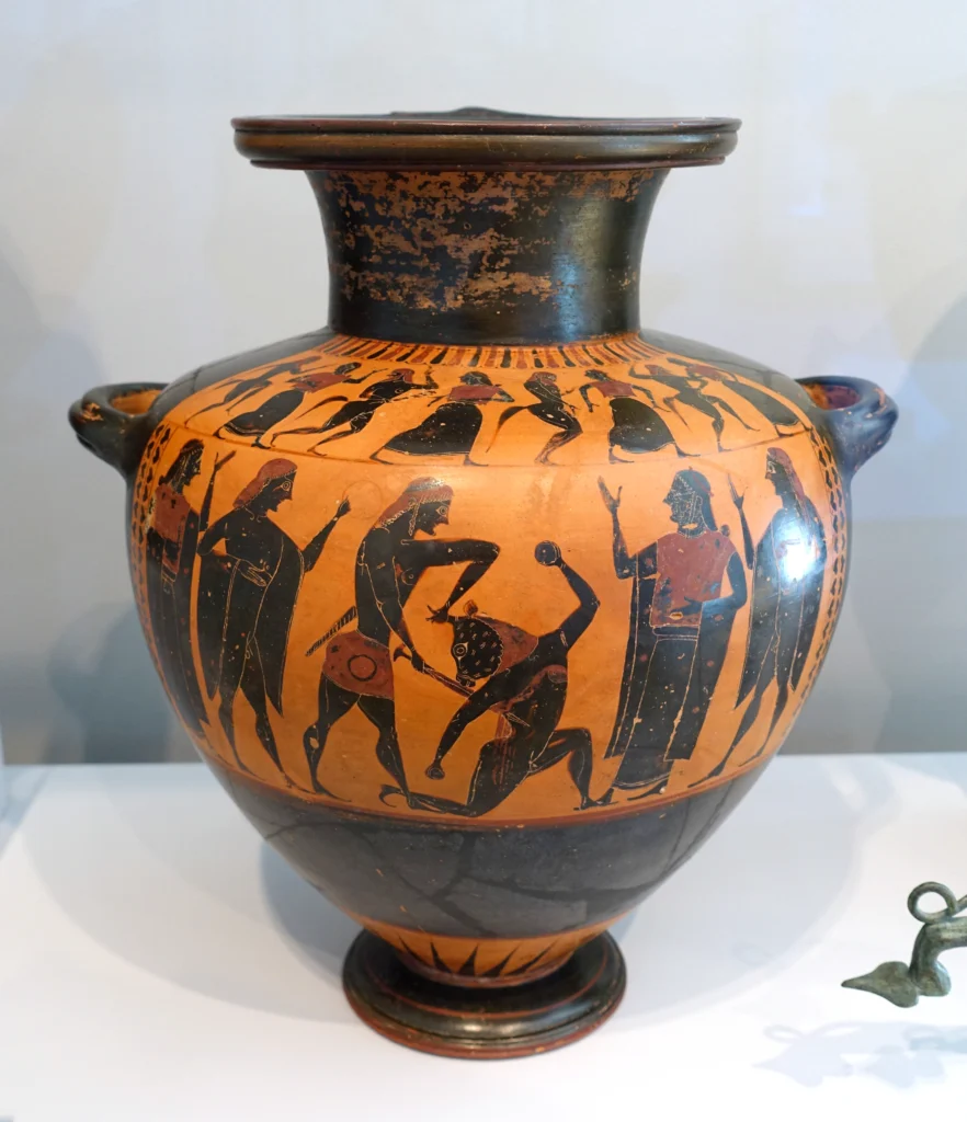 Ancient Greek Attic black-figure pottery showing Theseus slaying the Minotaur on a terracotta hydria.